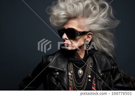 This stock photo captures a senior woman exuding a unique punk style. Her attire defies norms, symbolizing individuality, rebellion, and empowerment. She embodies nonconformity, with a vibrant This stock photo captures a senior woman exuding a unique punk style. Her attire defies norms, symbolizing individuality, rebellion, and empowerment. She embodies nonconformity, with a vibrant 108778501