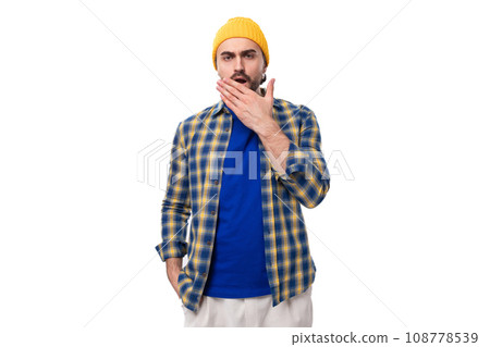young brutal brunette man with a beard and mustache surprised on white background with copy space young brutal brunette man with a beard and mustache surprised on white background with copy space 108778539