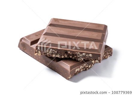 Traditional pieces of delicious Christmas chocolate nougat isolated on white background Traditional pieces of delicious Christmas chocolate nougat isolated on white background 108779369