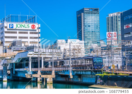 Yokohama cityscape in Japan View of Sotetsu Line Yokohama Station and trains entering the platform Yokohama cityscape in Japan View of Sotetsu Line Yokohama Station and trains entering the platform 108779455