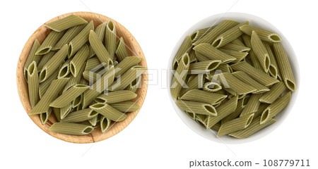 Green pea penne pasta in wooden bowl isolated on white background . Organic food speciality. Gluten free. Top view. Flat lay 108779711