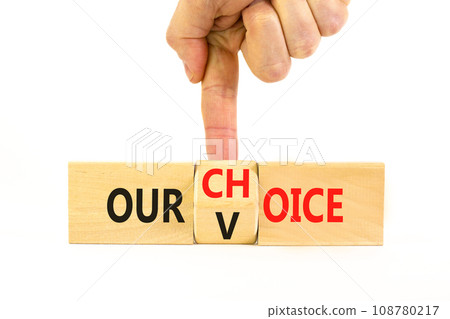 Our voice choice symbol. Businessman turns wooden cube and changes concept word Our choice to Our voice. Beautiful white table white background, copy space. Business and our voice choice concept Our voice choice symbol. Businessman turns wooden cube and changes concept word Our choice to Our voice. Beautiful white table white background, copy space. Business and our voice choice concept 108780217