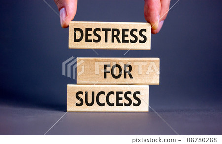 Destress for success symbol. Concept words Destress for success on wooden blocks. Doctor hand. Beautiful grey background. Psychological business and destress for success concept. Copy space. 108780288