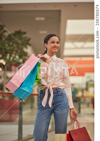 Happy Woman Walking with Shopping Bags in Shoping Mall Happy Woman Walking with Shopping Bags in Shoping Mall 108780874