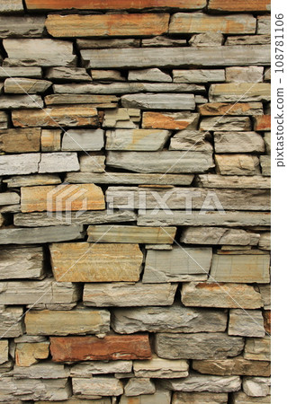 Multi colored dry stone wall in Ghandruk, Nepal. 108781106