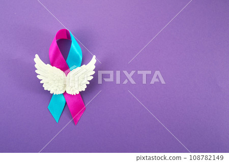 World Prematurity Day with Pink and Blue Ribbon and angel wings 108782149