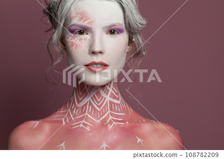 Perfect fashion model woman fantasy witch with stage makeup, studio portrait Perfect fashion model woman fantasy witch with stage makeup, studio portrait 108782209