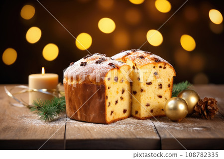 Christmas panettone cake with chocolate chips on rustic wooden table 108782335