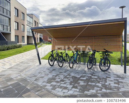 covered bicycle parking in a residential area covered bicycle parking in a residential area 108783496