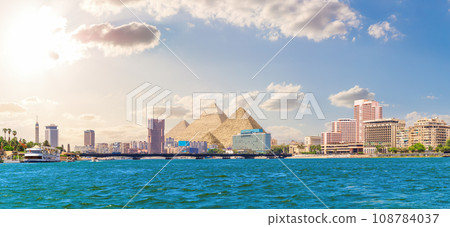 The Nile scenery and famous Pyramids, unique view of Cairo, Egypt The Nile scenery and famous Pyramids, unique view of Cairo, Egypt 108784037