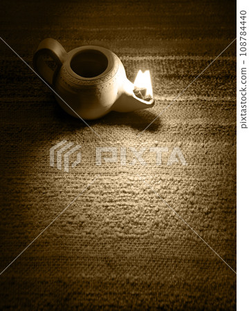 Ancient lamp shines in the dark Ancient lamp shines in the dark 108784440