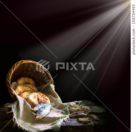Five loaves and two fish in a basket 108784493
