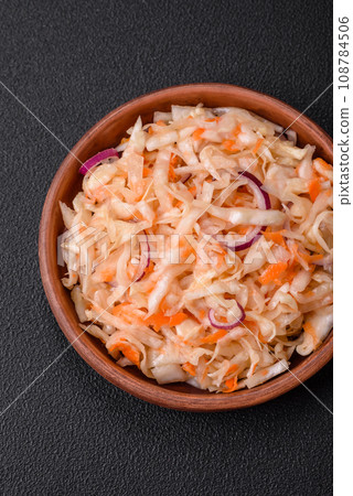 Delicious pickled salted cabbage with carrots, salt and spices Delicious pickled salted cabbage with carrots, salt and spices 108784506