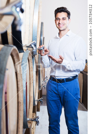 Winery owner standing in shop 108784812