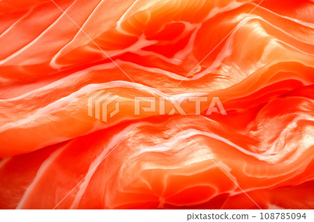 Closeup of the salmon slices with a red streaked texture. Macro photo of natural Atlantic Norwegian trout fillet Closeup of the salmon slices with a red streaked texture. Macro photo of natural Atlantic Norwegian trout fillet 108785094