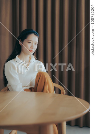Woman relaxing in a cafe Woman relaxing in a cafe 108785204