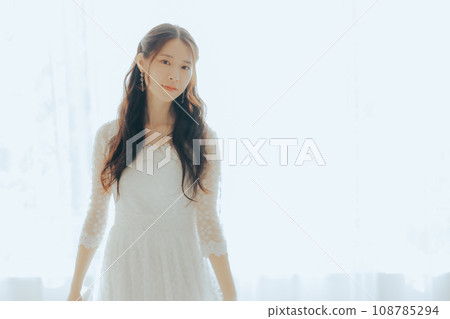 A woman in a white dress A woman in a white dress 108785294