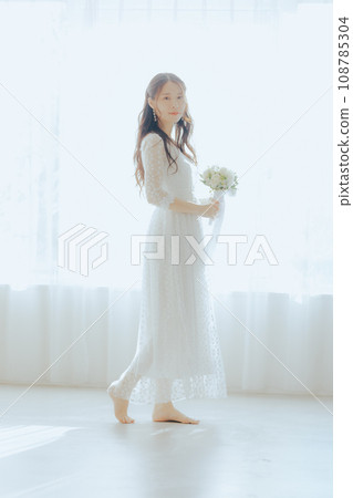 A woman in a white dress A woman in a white dress 108785304