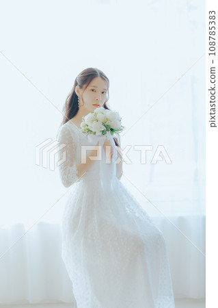 Young woman with bouquet Young woman with bouquet 108785383