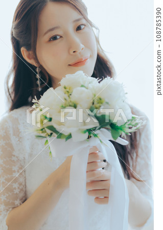 Young woman with bouquet Young woman with bouquet 108785390