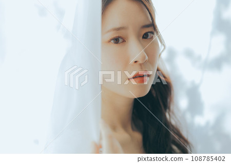 Young woman with bouquet Young woman with bouquet 108785402