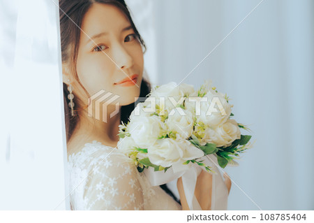 Young woman with bouquet Young woman with bouquet 108785404