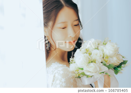Young woman with bouquet Young woman with bouquet 108785405