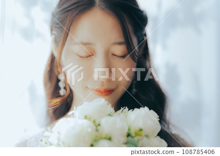 Young woman with bouquet Young woman with bouquet 108785406