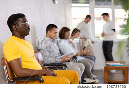 Portrait of an african american man sitting waiting 108785660