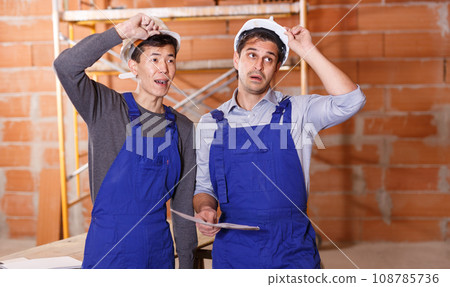 Two shocked professional builders Two shocked professional builders 108785736