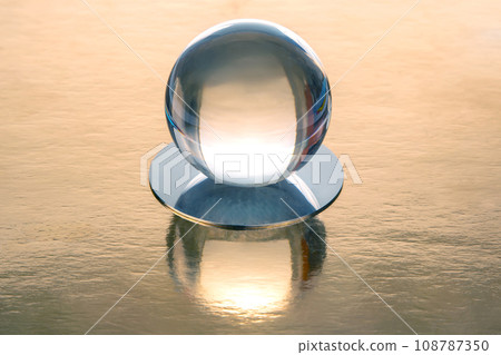 round transparent ball on a golden background round transparent ball on a golden background 108787350