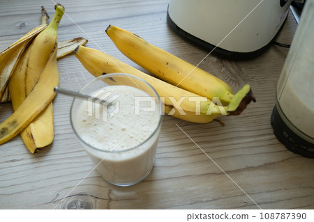 Vegan banana smoothie at the kitchen on the table 108787390
