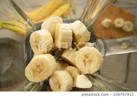 Vegan banana smoothie at the kitchen on the table Vegan banana smoothie at the kitchen on the table 108787415
