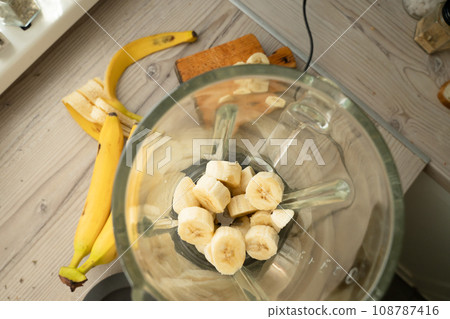 Vegan banana smoothie at the kitchen on the table Vegan banana smoothie at the kitchen on the table 108787416