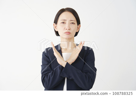 Middle-aged business woman making a mark gesture with her arm, white background 108788325