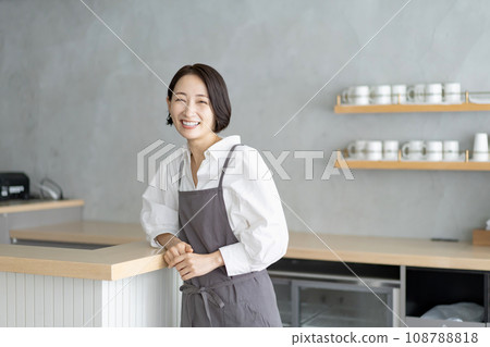 A woman in an apron A woman in an apron 108788818