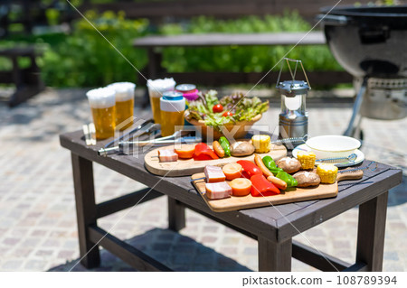 Get together with friends and prepare a barbecue Get together with friends and prepare a barbecue 108789394