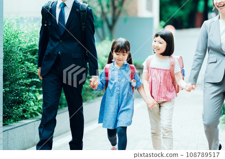 Parents and children going to school Parents and children going to school 108789517