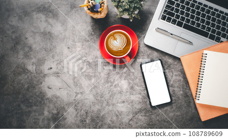 Office desk workplace with blank screen smart phone, laptop, pen, notebook and cup of coffee, Top view flat lay with copy space. Office desk workplace with blank screen smart phone, laptop, pen, notebook and cup of coffee, Top view flat lay with copy space. 108789609