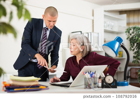 Man and woman clerical workers in office 108792016