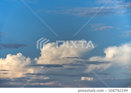 Cumulus clouds with a broad spectrum of blue shades 108792294
