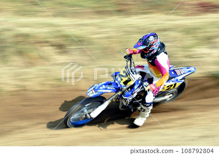 Motocross bike running at speed Motocross bike running at speed 108792804