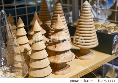 Christmas wooden trees in the shop. christmas decoration, New Year shopping Christmas wooden trees in the shop. christmas decoration, New Year shopping 108793354
