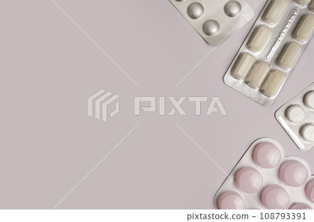 frame from pharmaceuticals antibiotics pills medicine on light gray background, copy space 108793391
