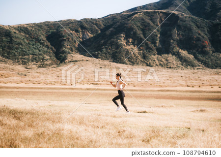 A woman jogging in nature A woman jogging in nature 108794610