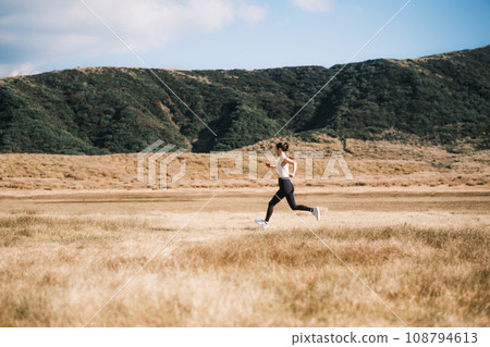 A woman jogging in nature 108794613