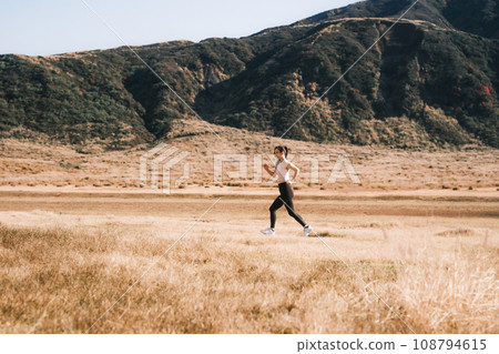 A woman jogging in nature 108794615