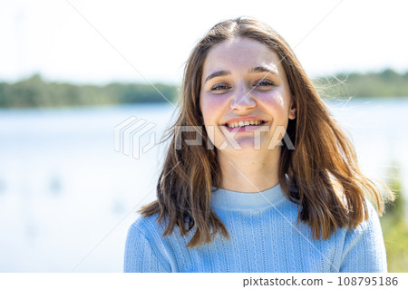 Joyful Style: Girl's Radiant Smile in Nature 108795186