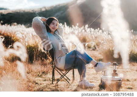 A woman camping solo in nature 108795488