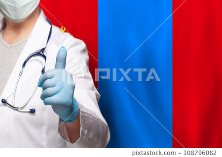 Mongolian doctor's hand showing thumb up positive gesture on flag of Mongolia background Mongolian doctor's hand showing thumb up positive gesture on flag of Mongolia background 108796082